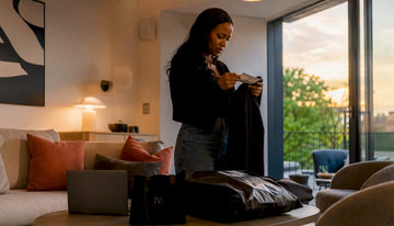 Woman preparing parcel for UK clothing return