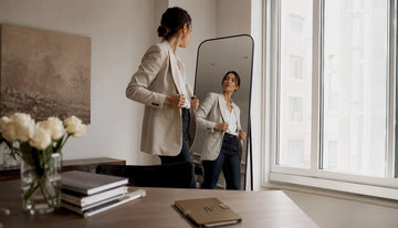 Woman changing casual to smart outfit in wardrobe