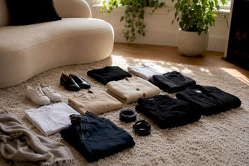 Flat lay of travel capsule wardrobe essentials