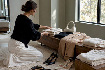Woman styling versatile wardrobe pieces