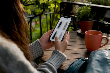 Hands scrolling women's dress shopping app