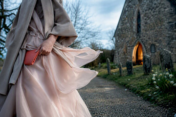 Guest outfit braced for windy spring ceremony